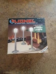 '94 Lionel O/O27 Ga. Operating Street Lamps 6-12874(NEW, Sticker Residue Box). Fixed Price $20.23.