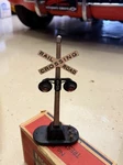 Lionel No. 154 Gauge Railroad Crossing Signal, Black, Light Function, Vintage. Fixed Price $30.00.