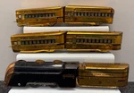 Marx Mercury Articulated Steam Engine Train W/ 4 Copper Cars - New York Central. Fixed Price $350.00.