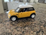 Yellow Mini Cooper Scale 1/28 Die Cast Kinsmart Pull Back. Fixed Price $6.25.
