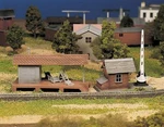 Bachmann 45977 Plasticville Loading Platform And Crossing Shanty Kit. Fixed Price $31.25.