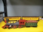 Lionel Gauge General Locomotive & Tender With Two Passenger Cars. Fixed Price $300.00.