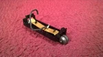 Lionel Post War 5511 Tie-jector Car Pick-up Collector Roller Assy. Fixed Price $11.95.