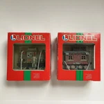Pair Of Lionel Train Ornaments 37-602 Caboose 37-616 Locomotive Christmas. Fixed Price $20.00.