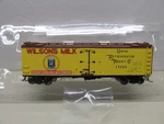 Red CABOOSE-#RR-34319-02-WILSON'S Milk-reefer #17502-HO Scale. Fixed Price $32.00.