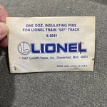 Lionel 027 Insulating Track Pins, 6-65041, Dozen New. Fixed Price $5.00.