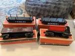 Lionel Postwar - 3451 & 3461 Log Cars, 3559 Coal Dump, 2458 Boxcar. Fixed Price $60.00.