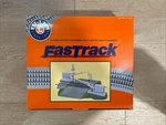 New Lionel Fastrack Grade Crossing With Gates And Flashers 6-12062. Fixed Price $149.99.