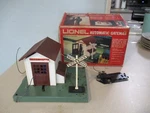 Scale Automatic Gateman #6-2145 Lionelville Lighted Shed With Flagman. Fixed Price $106.25.