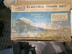 Lionel Gauge Analog Starter Set W/ Locomotive, Freight Car, Track, Lights. Fixed Price $118.00.