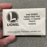 Lionel 6-65543 Gauge Fiber Track Pins, Dozen, New And Sealed. Fixed Price $5.00.