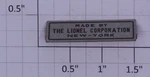 Lionel 100X Prewar Nickel Made By Corp. Nameplate (10). Fixed Price $25.00.