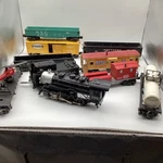 Lionel Nyctrains 7794 8-0STEAM And Several Freight Cars Full Circle Track. Fixed Price $375.00.