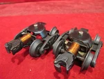 Lionel Postwar Pair Copper Coil Staple End Trucks With Slide Shoe Pick Ups. Fixed Price $12.50.