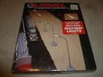 New Lionel Set Of Four Operating Higway Lights 6-12804 And 027 Gauge Nib. Fixed Price $29.99.