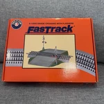 Lionel 6-12052 Fastrack Grade Crossing With Flashers. Fixed Price $69.99.