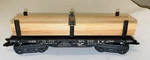 Marx No. 33773 Boston & Maine Flatcar With Lumber Load - Type Trucks. Fixed Price $60.00.