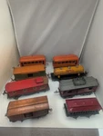 Lionel Trains Postwar Lot Of 8 Mix Passenger, Gas, Caboose, And Box Cars. Fixed Price $149.99.
